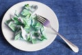 Crumpled money on a plate Royalty Free Stock Photo
