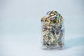 Crumpled naira notes in a glass jar concept of savings