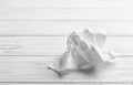 Crumpled napkin on wooden background, space for text. Royalty Free Stock Photo