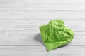 Crumpled napkin on wooden background, space for text. Royalty Free Stock Photo