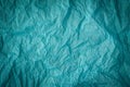 Grunge cyan paper texture. Crumpled old dirty cardboard distressed and industrial background design. Royalty Free Stock Photo