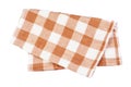 Crumpled orange brown checkered napkin table clothes on white background