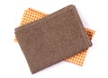 Crumpled orange brown checkered napkin table clothes on white background