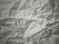 Crumpled paper background with soft light used to advertising template background.