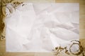 Crumpled paper with coffee stained on wood