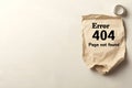Crumpled paper with "Error 404 Page Not Found" message for web design, UI error pages, or artistic digital projects Royalty Free Stock Photo