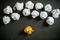 Crumpled paper symbolizing different solutions with one standing out Royalty Free Stock Photo