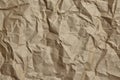 Crumpled paper, texture, background. Brown craft paper with wrinkled pattern