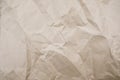 Crumpled paper texture for background. Rumpled kraft paper with copy space