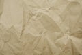 Crumpled paper texture for background. Rumpled kraft paper with copy space