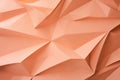 Crumpled peach fuzz color paper texture background. The wrinkled design paper. Recycling