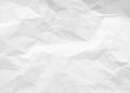 Crumpled paper texture. White battered paper background. White empty leaf of crumpled paper. Torn surface of letter blank