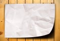 Crumpled paper on wood table Royalty Free Stock Photo