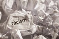 Paper written racism. Concept of old and abandoned idea or practice. Royalty Free Stock Photo