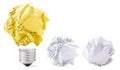 Crumpled paper in a yellow lamp base on a white. Good idea Royalty Free Stock Photo