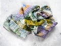 Crumpled patchwork scarf sewn from silk fabrics Royalty Free Stock Photo