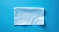 A crumpled piece of paper on a blue background