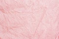 Crumpled pink crepe paper texture, pastel background