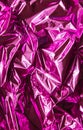 Crumpled pink foil. The background shimmers with rainbow colors Royalty Free Stock Photo