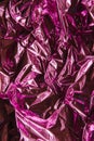 Crumpled pink foil. The background shimmers with rainbow colors Royalty Free Stock Photo