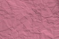 Crumpled pink paper texture interesting background for various design projects. Royalty Free Stock Photo