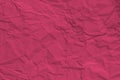 Crumpled pink paper texture interesting background for various design projects. Royalty Free Stock Photo