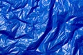 Crumpled polyethilene film abstract background with selective focus