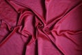 Crumpled red cloth texture background. close up top view of wavy natural colorful cloth material surface Royalty Free Stock Photo