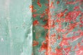 Crumpled scratched metal surface of red and green color