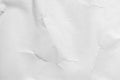 Crumpled and shabby empty white paper texture background