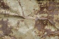 Crumpled sheet of metal. Rusty and oxidized background. Old iron panel. Dirty white, brown and black rust on a white metal plate. Royalty Free Stock Photo