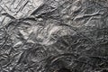 Crumpled and shiny silver paper background. Crumpled foil texture Royalty Free Stock Photo