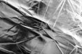 Crumpled silver material as abstract background