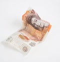 A crumpled ten pound note