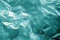Crumpled transparent plastic  surface in cyan tone Royalty Free Stock Photo