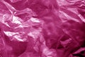 Crumpled transparent plastic  surface in pink tone Royalty Free Stock Photo