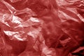 Crumpled transparent plastic  surface in red tone Royalty Free Stock Photo