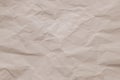 Crumpled vintage paper background. Texture of creased beige sheet. Wrinkled page, pattern. Copy space. Light pink wrinkle cardboar Royalty Free Stock Photo