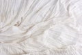 Crumpled white cotton fabric, fabric for sewing clothes and shirts Royalty Free Stock Photo