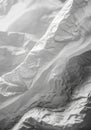 Crumpled white paper with a textured surface creates an abstract pattern. The light and shadow play Royalty Free Stock Photo