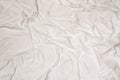 Crumpled white sheet texture with messy abstract pattern