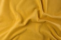 Crumpled yellow beach towel as background, top view Royalty Free Stock Photo