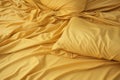 Crumpled yellow bed linen