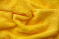 Crumpled yellow terry towel background Royalty Free Stock Photo