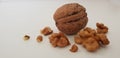 Crunch Pieces of Walnut Kernel and One Whole Nut in Nutshell