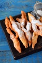 Crunchy brushwood cookies dusted with sugar powder