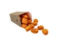 Crunchy chicken popcorn bites in carton container for fast food meals isolated on white background Royalty Free Stock Photo