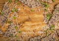 Crunchy crispy seed homemade bread decorated with microgreen sprouts on a wooden table. Healthy snack. multigrain cereal flax,