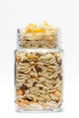 Crunchy Diet Mixture in a glass jar, made with Puffed Rice, Corn Flakes, and Curry leaves.