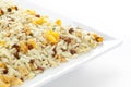 Crunchy Diet Mixture in a white ceramic square plate made with Puffed Rice Corn Flakes and Curry leaves.